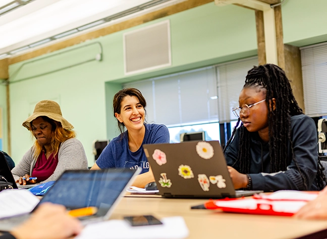 Female student smiling for photo in ESOL class